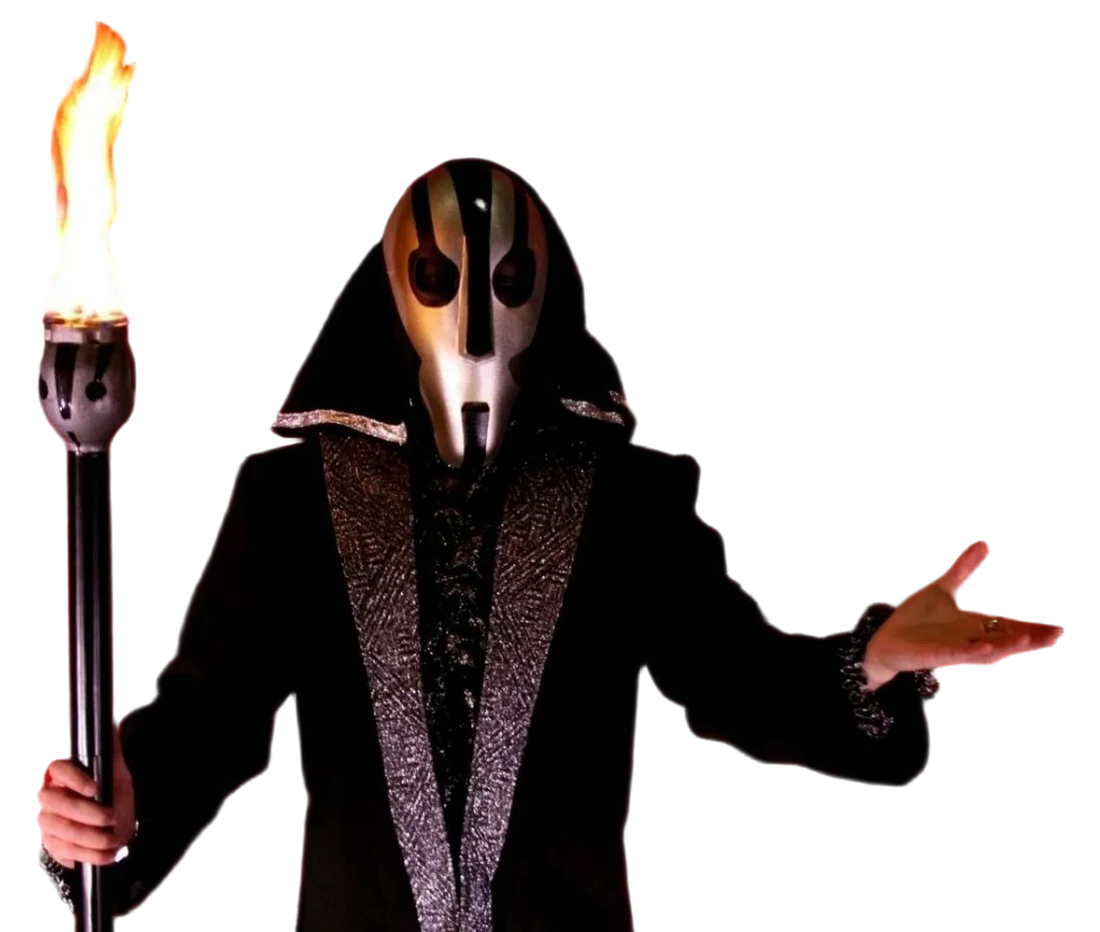 Daniel Kane i mask som scenkaraktär ur illusionsshowen, med en brinnande fackla